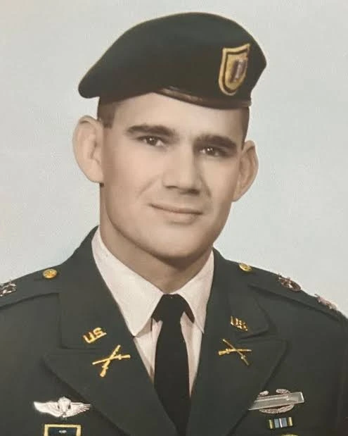 Archival military portrait of a Turman family member wearing a beret