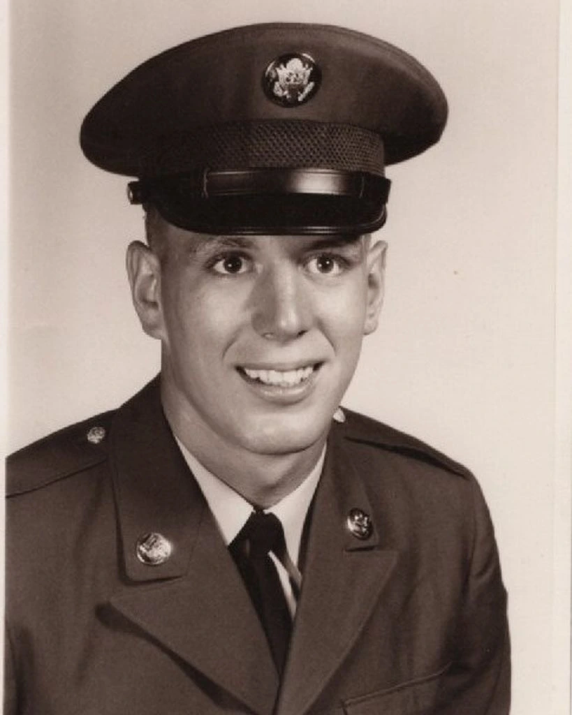 Archival military portrait of a Turman family member wearing a service cap